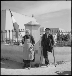 Elderly woman and man welcome New Zealanders at Sousse, Tunisia, in World War II - Photograph taken by M D Elias
