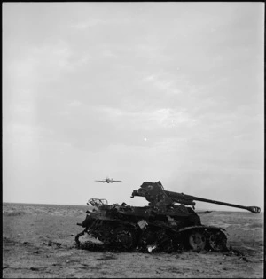 Tank buster aircraft and a shot up anti tank gun in Tunisia, World War II - Photograph taken by M D Elias