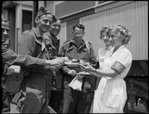 Red Cross women distribute refreshments to repatriated troops from Italy at Alexandria, World War II - Photograph taken by H Paton