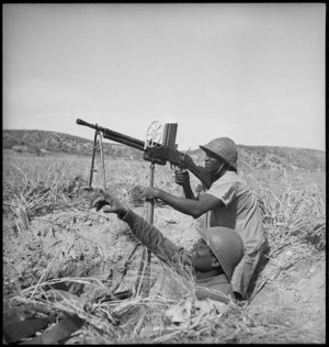 Senegalese troops with Free French forces operating machine gun in Tunisia, World War II - Photograph taken by M D Elias