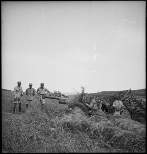 General Phillippe Leclerc examines a French 75mm gun in Tunisia during World War II - Photograph taken by M D Elias