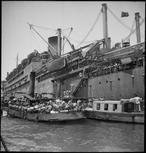 NZ reinforcements arrive at Suez and disembark by lighter, World War II - Photograph taken by S Wemyss