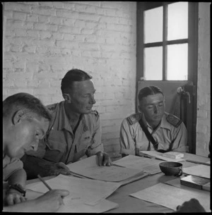 Officers making up lists of personnel eligible for leave home, Maadi, Egypt - Photograph taken by Harold Gear Paton