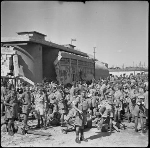 Men of the New Zealand Main Body sort out their gear on arrival at Taranto, Italy, World War II - Photograph taken by W A Brodie
