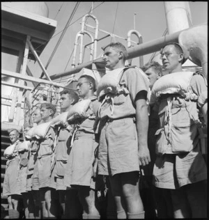 Men of 2 NZ Division at boat stations on transport en route to Italy, World War II - Photograph taken by M D Elias