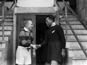 Frank Kilby and George Nepia shaking hands after a rugby match at Athletic Park, Wellington