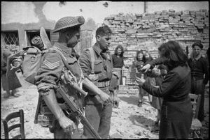 Two New Zealand Infantrymen receive wine from one of the inhabitants of Barbiano, Italy - Photograph taken by George Kaye