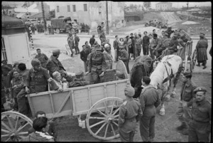 German prisoners, driving themselves in a horse and cart, are handed over to NZ troops near the end of World War II - Photograph taken by George Kaye