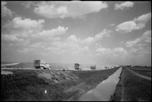 NZ Division vehicles on their advance through flat country near the River Po, Italy, World War II - Photograph taken by George Kaye