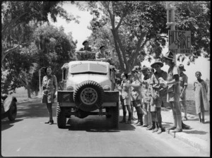 New Zealand soldiers on leave standing at official hitch hiking point in Cairo, World War II - Photograph taken by G Kaye