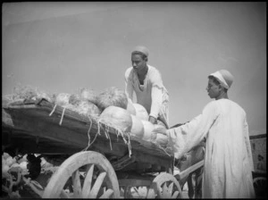 Two locals with a cartload of melons in the melon market, Cairo - Photograph taken by George Kaye