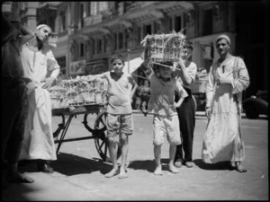 Local men and boys unloading eggs at the NZ Club in Cairo, World War II - Photograph taken by George Kaye
