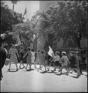 Women and children following triumphal parade through Tunis, World War II - Photograph taken by M D Elias
