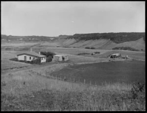 A view of the property 'Cloverdale', Hawkes Bay, showing the surrounding farmland and the milking sheds on the right side