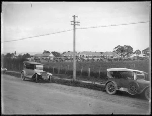 View from road of cars parked outside Hawke's Bay Soldiers Memorial Hospital [for the opening?] Hastings