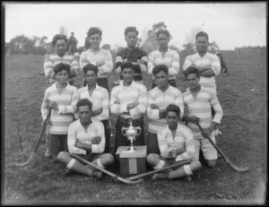 Maori boys' hockey team with trophy, Hastings