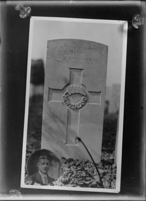 Gravestone of Thomas Booth, 4/1893 inscribed Sapper, NZ Engineers, at an unidentified cemetery, with a photograph inserted at bottom left