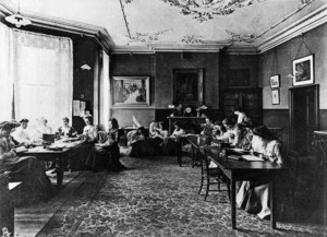 Pupils of Queens College, Harley Street, London, attend to their studies in the waiting room of the College