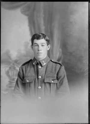 Head-and-shoulders studio portrait of an unidentified young man wearing military uniform, possibly Christchurch district