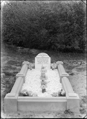 View of the grave, with flowers and headstone, of Stanley Edwin George Charles, died 28 August 1918 aged 13, son of A & M Charles, Linwood Cemetery, Christchurch region