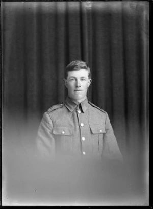 Studio upper torso portrait of unidentified World War I soldier with shoulder badges, Christchurch