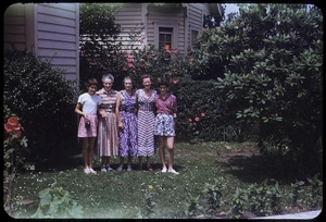 Group of women and girls in a garden, Milford, New Zealand