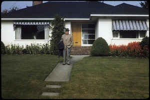 Man standing outside a house