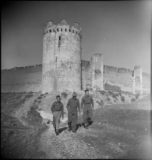 NZ soldiers beneath tower of the fortress of Lucera, Italy, World War II - Photograph taken by George Kaye