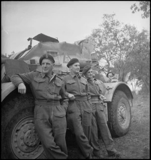 Three New Zealand soldiers beside their armoured car in Italy, World War II - Photograph taken by George Kaye