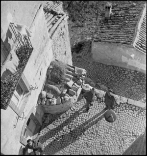 Looking down on sunny corner of cobbled street in the village of Furci, Italy, World War II - Photograph taken by George Kaye