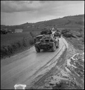 Vehicles of the NZ Divisional Cavalry make their way over muddy roads to the Italian battlefront, World War II - Photograph taken by George Kaye