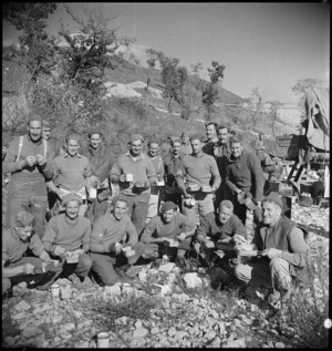 NZ engineers engaged in constructing a river crossing after bridge demolished, Italy, World War II - Photograph taken by George Kaye