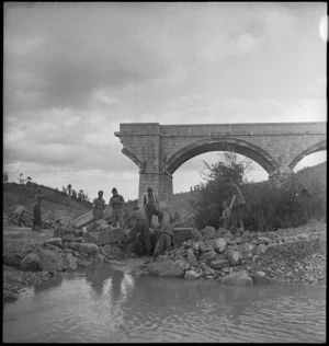 NZ engineers working to repair bridge in the Sangro River area, Italy - Photograph taken by George Kaye