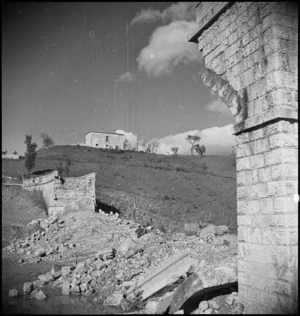 View of bridge wrecked by retreating German forces in Italy, World War II - Photograph taken by George Kaye