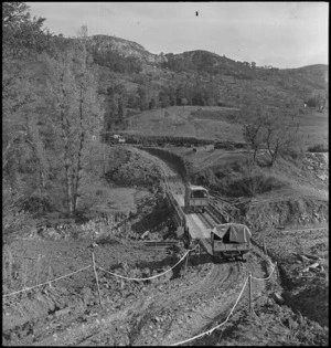 Transport of NZ Division crossing a deviation near the Italian front, World War II - Photograph taken by George Kaye