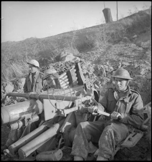 Anti aircraft gun crew in the forward area of the Sangro River in Italy, World War II - Photograph taken by George Kaye
