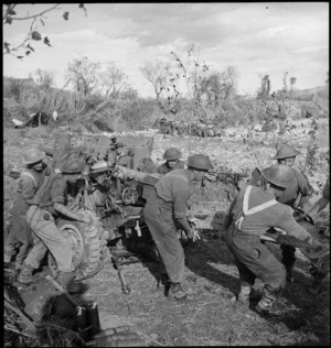 Gunners of a NZ Artillery battery shift their gun to new position, Italy, World War II - Photograph taken by George Kaye