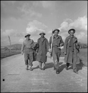 Four NZ sappers walking back from the front line in Sangro River area, Italy, World War II - Photograph taken by George Kaye