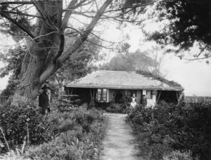 William Jenkins and his wife, alongside their cottage and garden, Rangiuru Road, Otaki