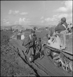 C J Cullen on his way out of the front line on Sangro River area passes bren carrier, Italy, World War II - Photograph taken by George Kaye