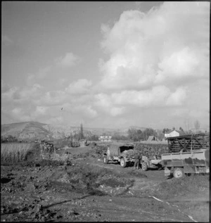 Support weapons of 24 NZ Infantry Battalion waiting to cross Tiki Bridge in Sangro River area, Italy, World War II - Photograph taken by George Kaye