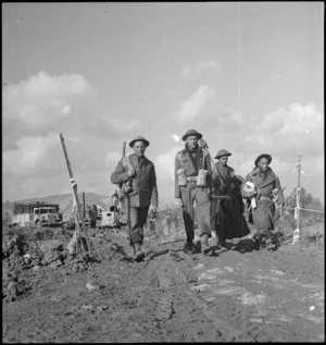 NZ Engineers coming out of the line after a night of minesweeping, Sangro River area, Italy, World War II - Photograph taken by George Kaye