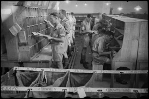 Bays for checking and sorting letters at the Chief NZ Post Office in Cairo, Egypt, World War II - Photograph taken by George Bull