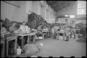 Personnel checking addresses at the Chief NZ Post Office Cairo, Egypt, World War II - Photograph taken by George Bull