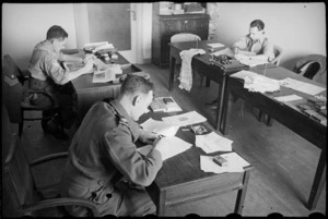 Some of the staff of the NZEF Times at work in the Cairo office, Egypt, World War II - Photograph taken by George Bull