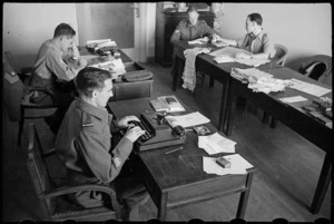 Portion of the staff at work in the NZEF Times office in Cairo, Egypt, World War II - Photograph taken by George Bull