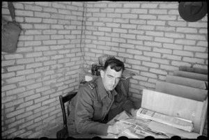 Editor of the NZEF Times, Mr H L Heatley at his desk in Cairo, Egypt, World War II - Photograph taken by George Bull