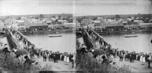 Crowd watching a boat race on the Waitara River