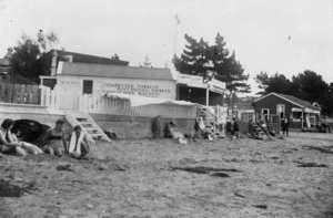 Groups, and business premises, on the beach at Milford, Auckland