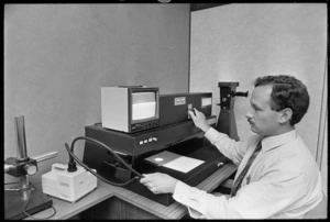 Ian Kain operating a Video Spectral Computer (VSC) - Photograph taken by Merv Griffiths